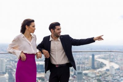 A luxury real estate agent shows a woman a Las Vegas property
